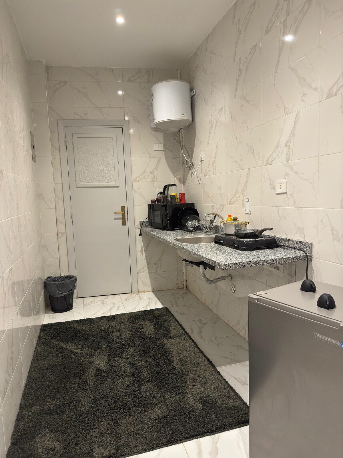 Kitchenette — granite counter and sink